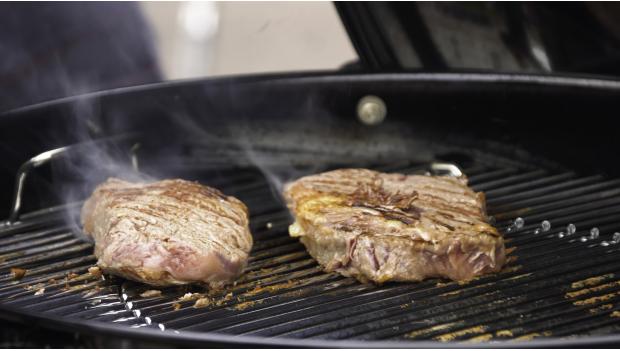 Cooking Steak Over Fire