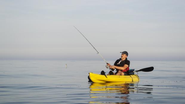 Fishing kayak on calm water